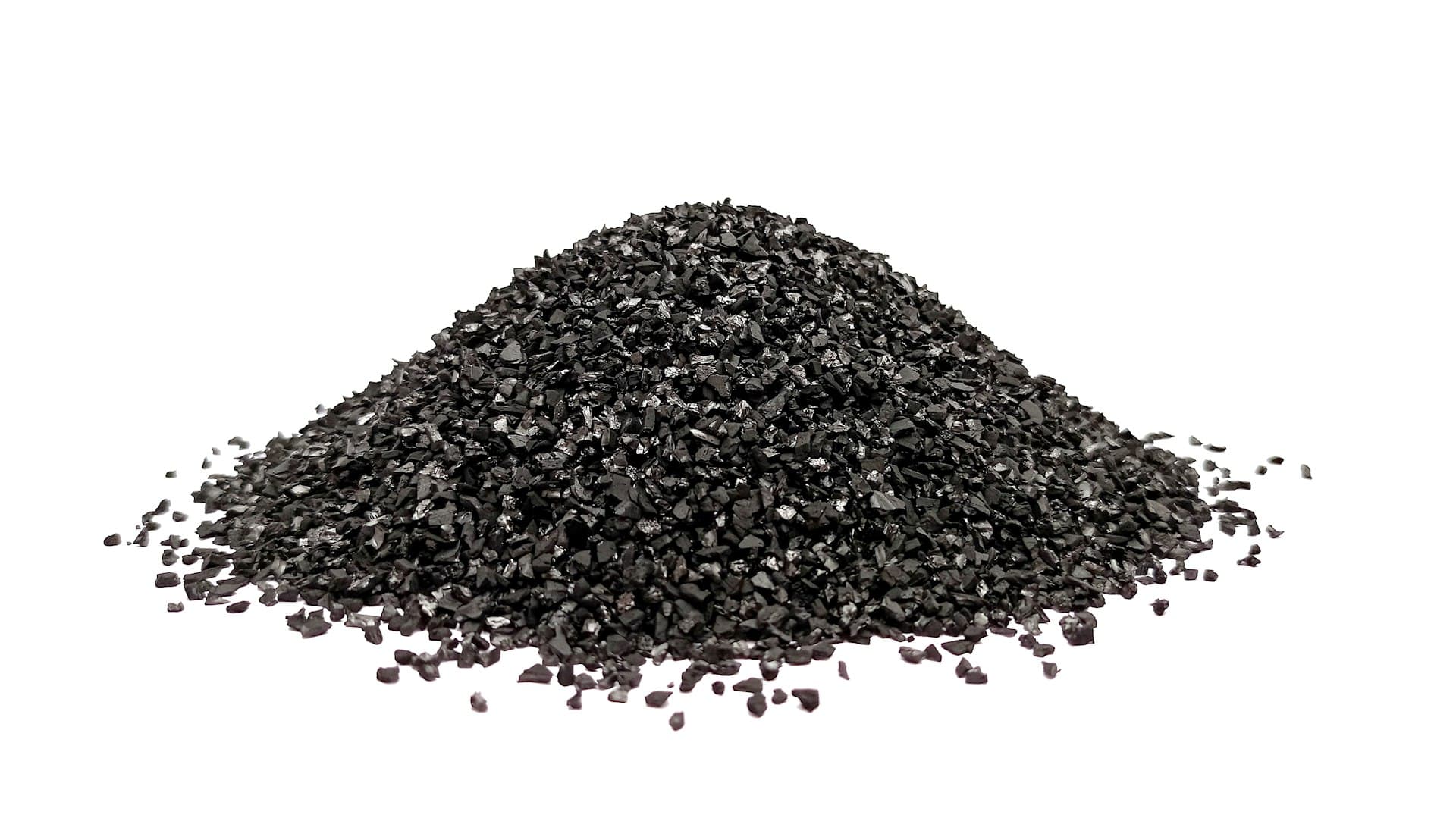 Pile of granular activated carbon — the adsorption media at the heart of carbon filtration