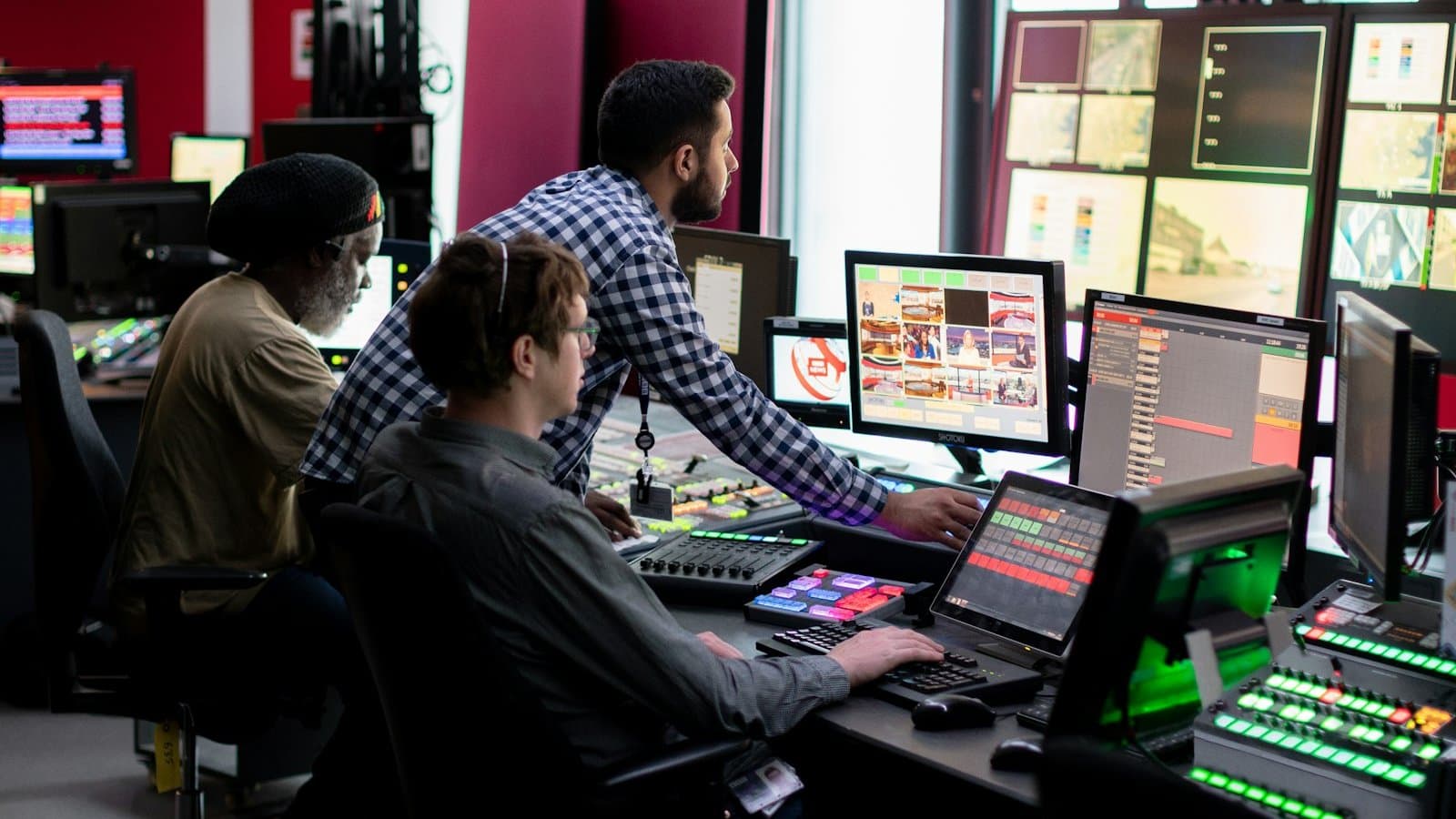 Engineer working with data and monitoring screens in an industrial setting, representing the practical applications of AI and machine learning in water treatment