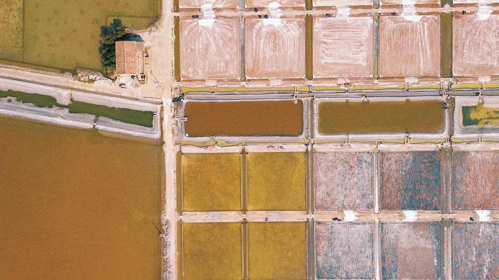 Aerial view of salt evaporation ponds concentrating brine into recoverable salts