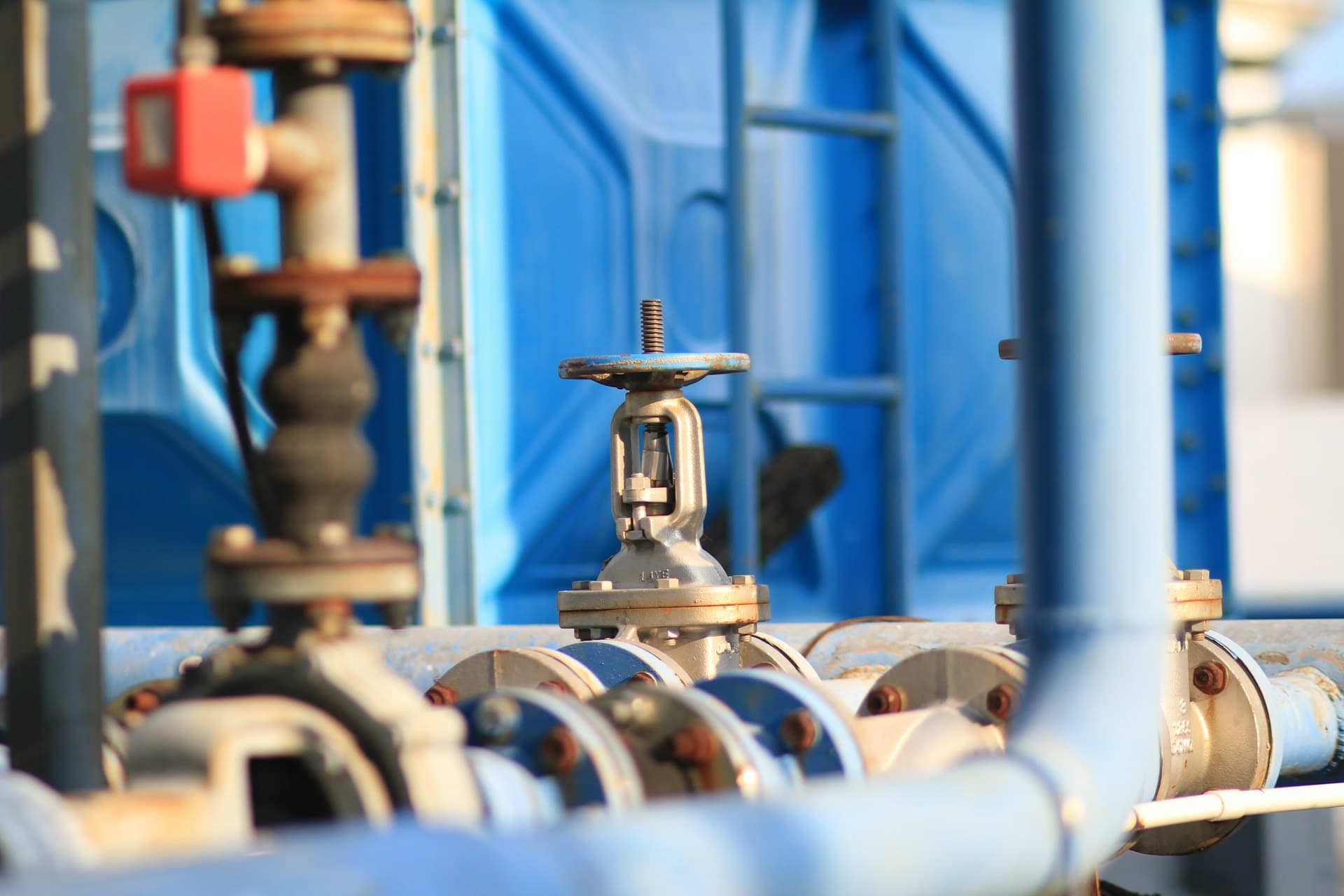 Steam-side valves and insulated pipework at a boiler plant — the circuit condensate polishing protects from corrosion products