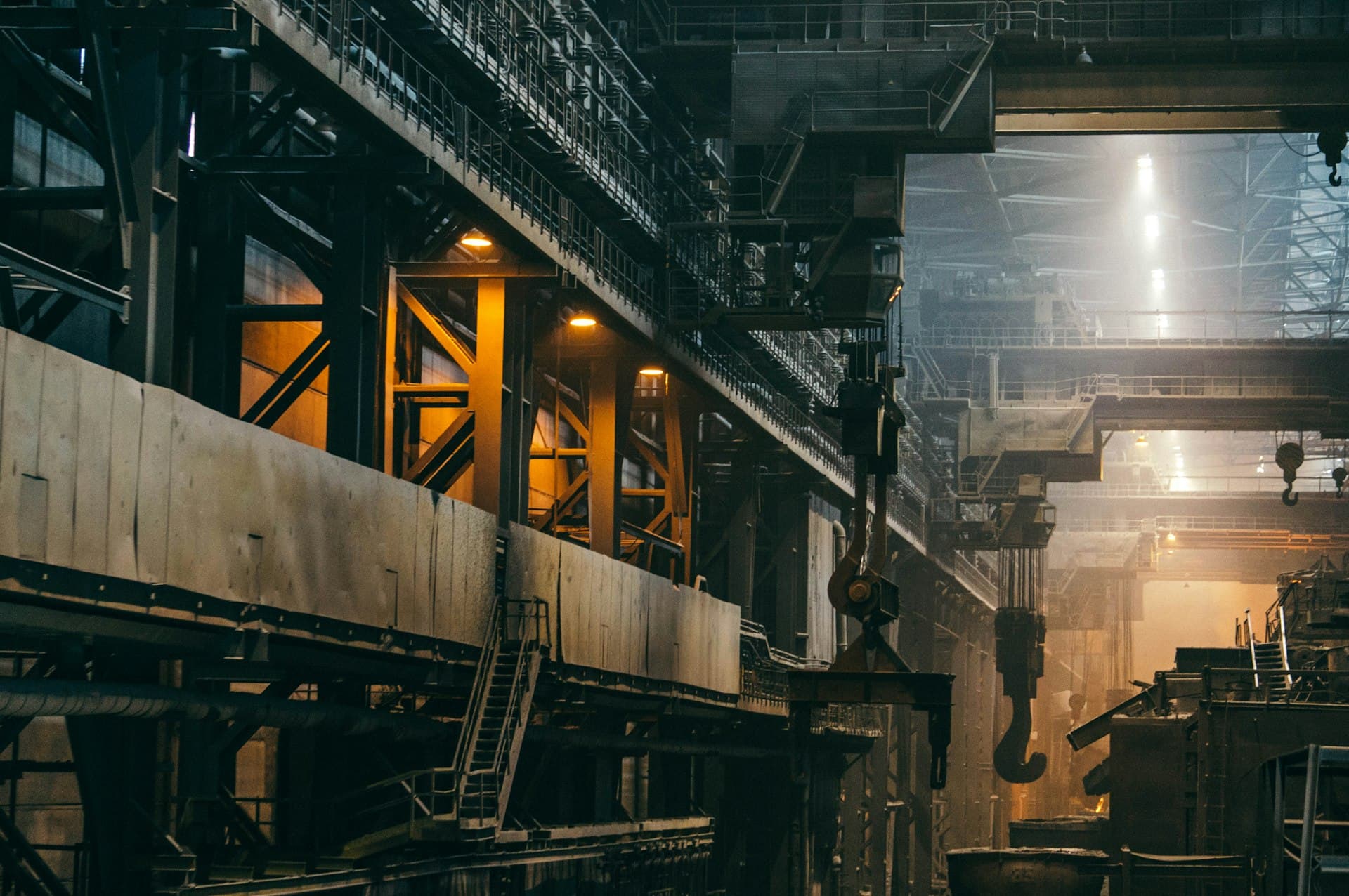Molten metal and heavy machinery inside a metalworks — the source of metal-laden rinse waters