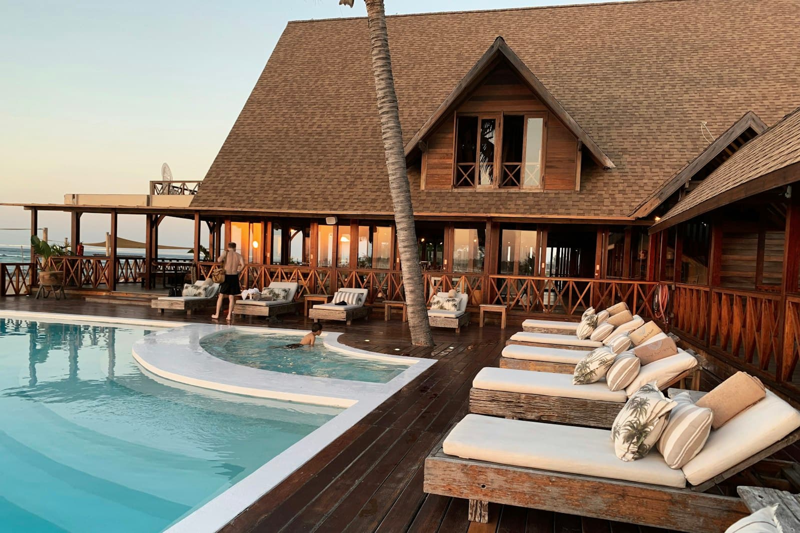 Luxury hotel interior courtyard with pool and water features, representing the multiple water systems a comprehensive hotel water treatment programme must cover