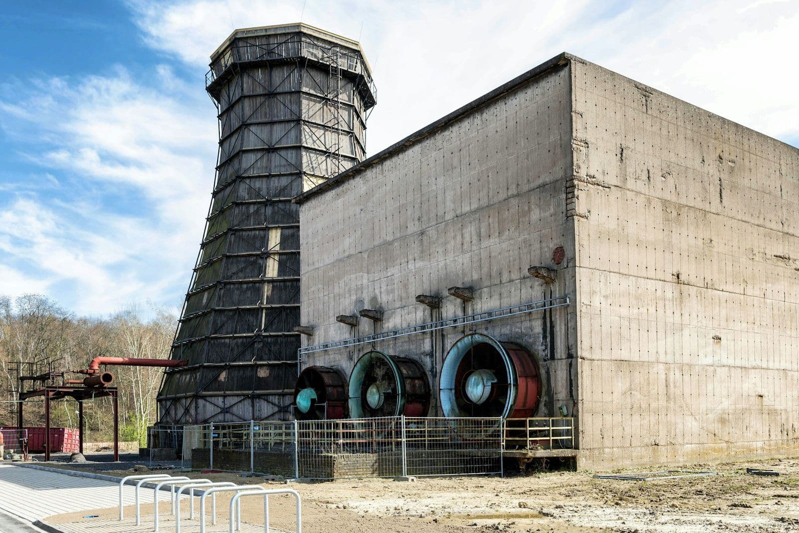 Industrial cooling tower with large fans mounted on its concrete casing