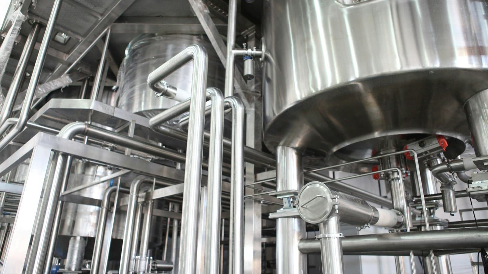 Industrial reverse osmosis pressure vessels and high-pressure pump skid in a process plant, representing the equipment scope a correctly sized RO system specification must cover