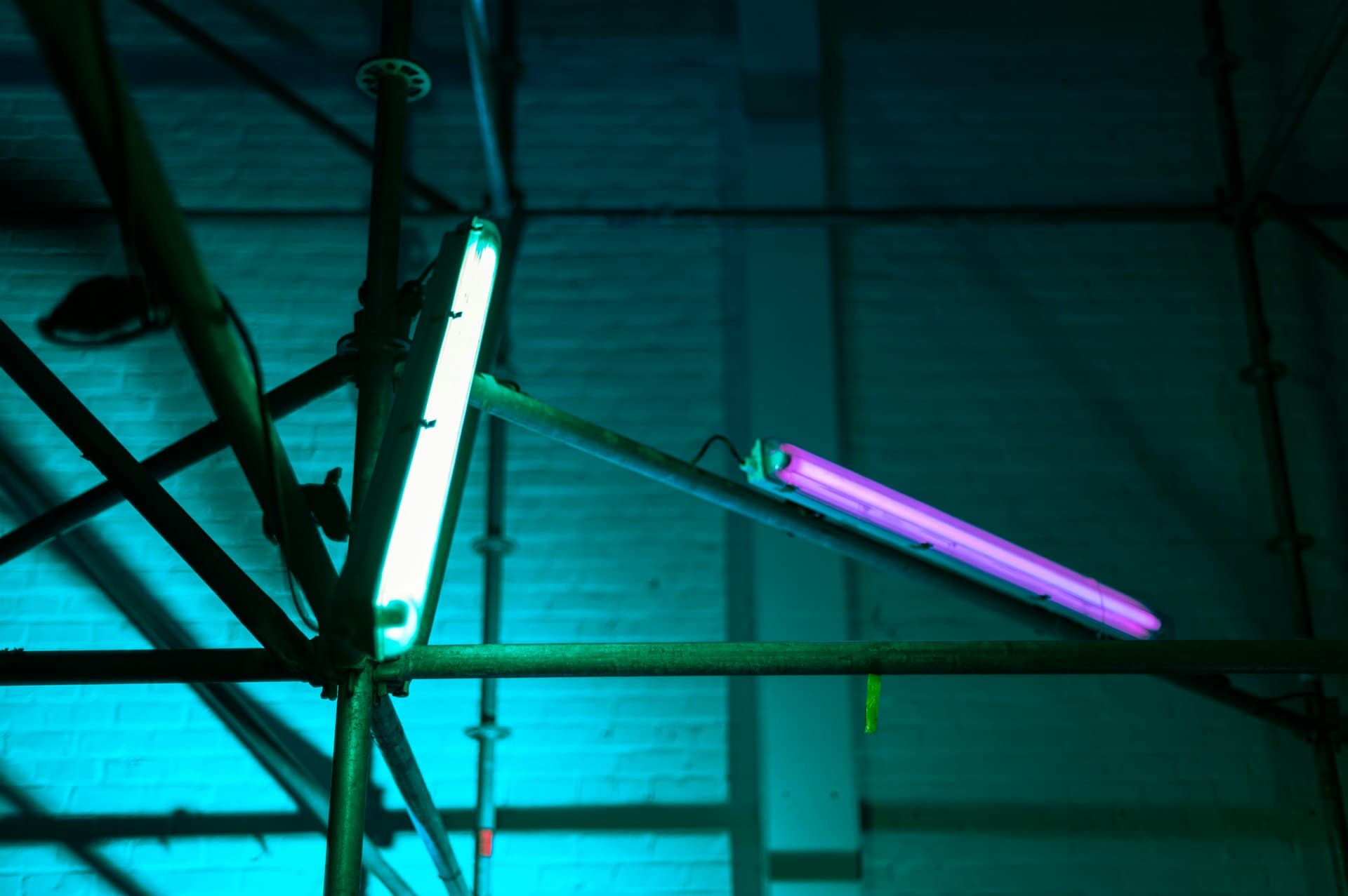 Germicidal lamp glowing over industrial pipework — inline disinfection in action