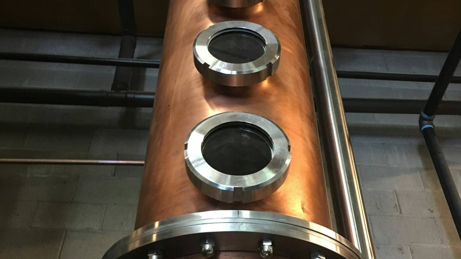 Brown industrial pipes showing the distribution infrastructure through which pollutants enter water systems, the compliance and treatment challenge at the centre of industrial water pollution management