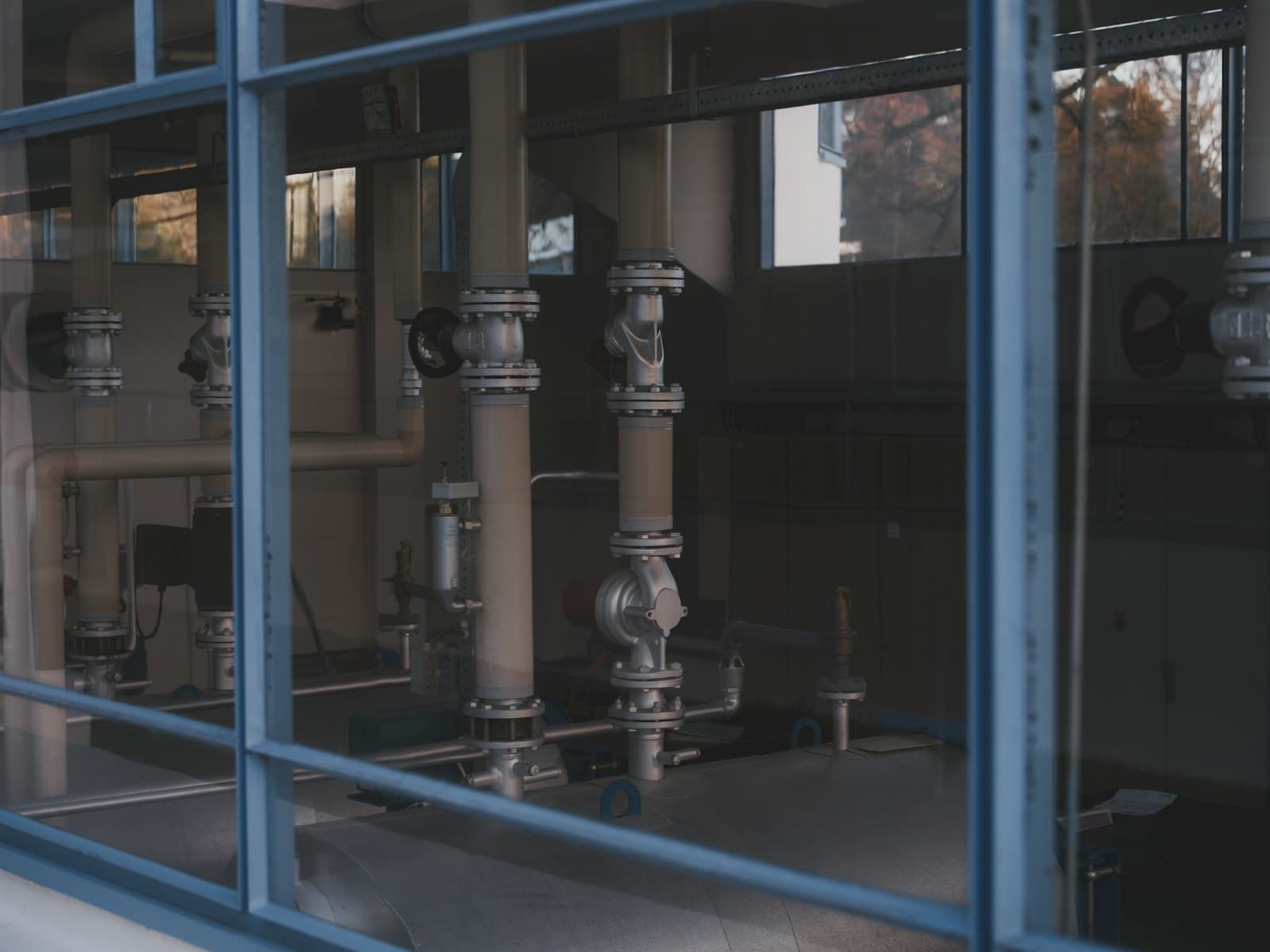 Pump gallery of an industrial water recycling installation seen through the plant window