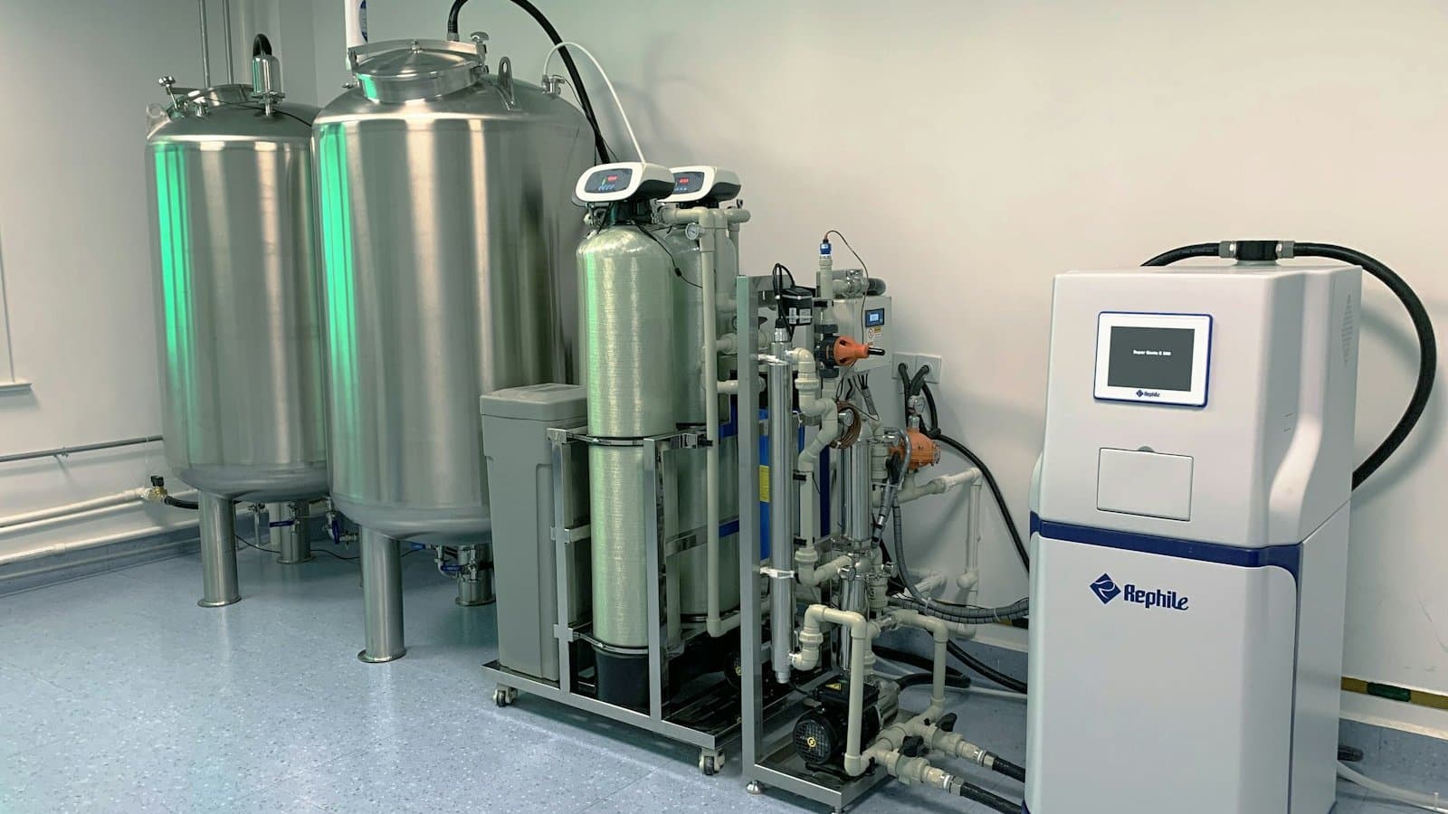 Industrial water purification system in a laboratory setting showing membrane filtration equipment