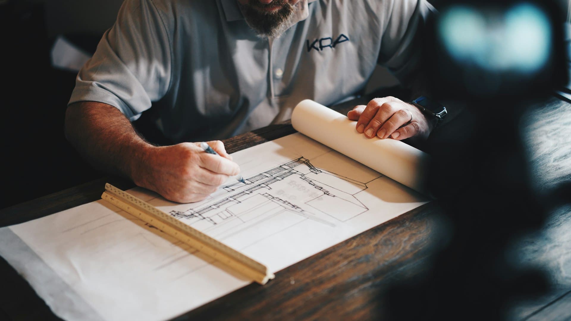 Engineer working through technical drawings by hand — the groundwork of a solid RFP