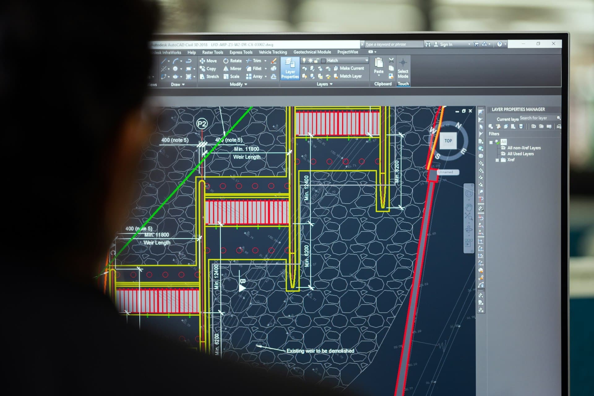 Civil engineer designing water structures in CAD software