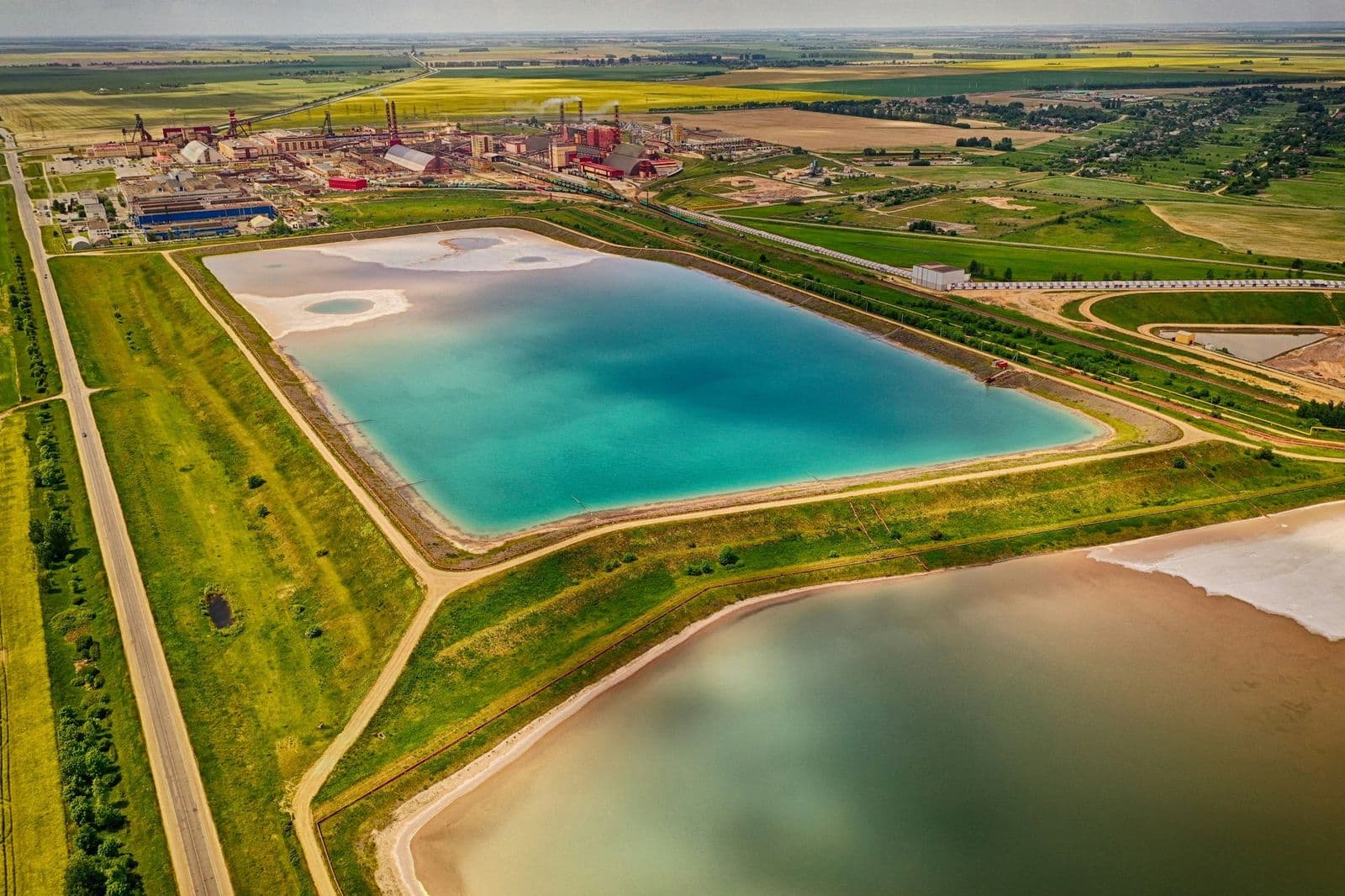 Aerial view of engineered brine evaporation ponds at an industrial site